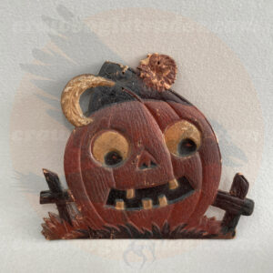 Rare pumpkin wearing fez cap and sitting in a fenced pumpkin patch - a small unusual German pressed paper import diecut of vintage Halloween collectible offered online by Craw-Bogle Trader collector's trade store (with buy-sell at times considered upon contact).