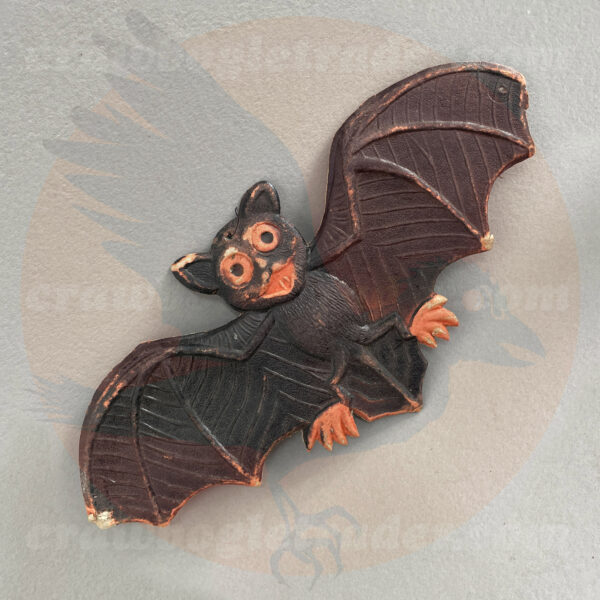 Vintage Halloween collectibles from The Craw-Bogle Trader collection of antique holiday items feature this antique German bat molded-paper diecut with a cartoon style face. Item is up for trade (an alternative to buying and selling).