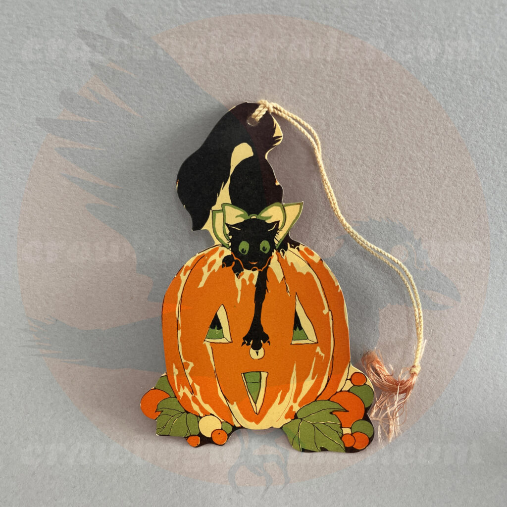 Cat touching the nose of Jack O'Lantern in orange, green, and yellow as a tally card - a Hallmark vintage Halloween collectible offered by trade/buy/sell Craw-Bogle Trader collector, a companion site to The Halloween Retrospect archive library.