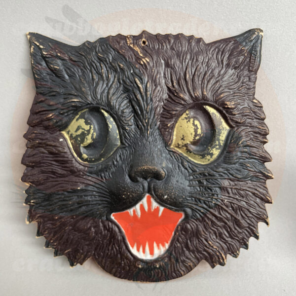 Cat face with detailed black fur, and large green eyes a German import pressed board diecut vintage Halloween collectible offered for trade options by Craw-Bogle Trader formerly a buy-sell collection, a companion to The Halloween Retrospect archive library.