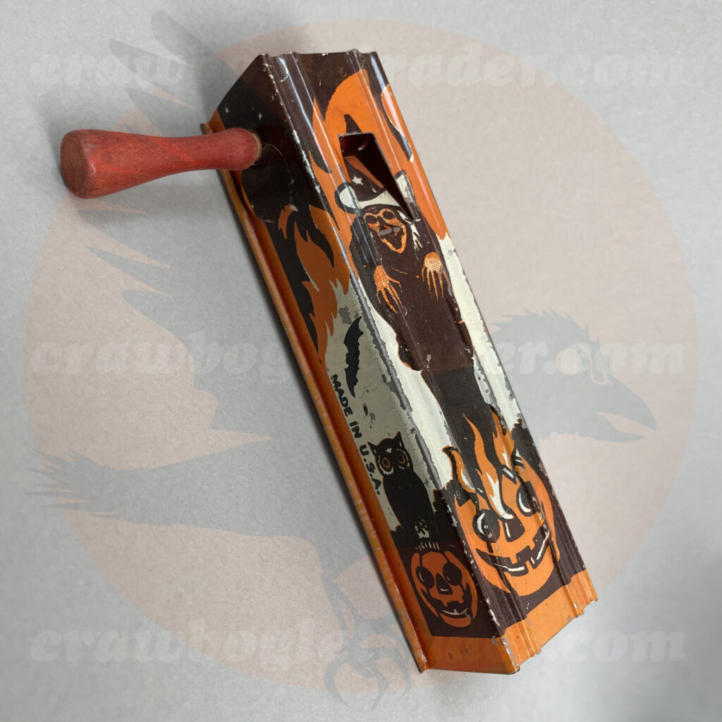 Vintage Halloween collectible ratchet noisemaker by Bugle Toy feature witch with jack o'lantern cauldron with nearby owl - offered by trade/buy/sell Craw-Bogle Trader collector, a companion site to The Halloween Retrospect archive library.