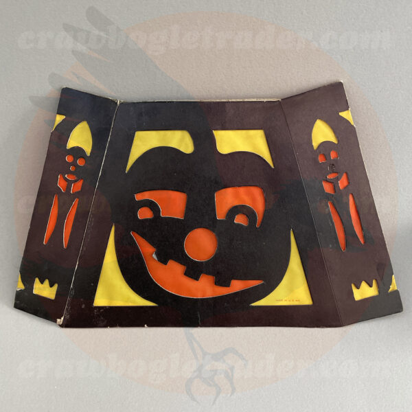 Side two of six-sided Beistle lantern with black frame jack o'lantern and orange and yellow transparent shade- a diecut paper vintage Halloween collectible offered by trade/buy/sell Craw-Bogle Trader collector, a companion site to The Halloween Retrospect archive library. The item is also featured in Halloween Artifacts, Volume 1: Lighting.