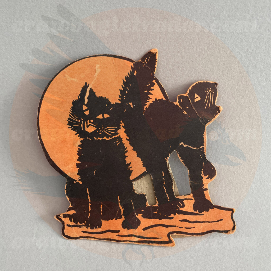 Two black cats with one singing under a full orange moon - a diecut paper vintage Halloween collectible offered by trade/buy/sell Craw-Bogle Trader collector, a companion site to The Halloween Retrospect archive library.