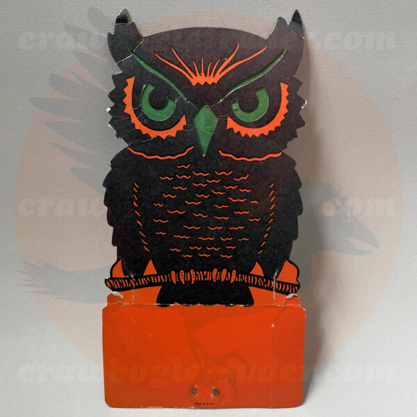 Orange and black owl diecut vintage Halloween decoration by Beistle is created to glow-in-the-dark with light placed behind the tissue paper - and is featured in The Halloween Retrospects full-color guidebook of vintage collectibles Halloween Artifacts, Volume 1: Lighting. The item itself is available for-trade from Craw-Bogle Trader (while buying and selling of vintage Halloween collections is also considered and please contact the online shop for details).