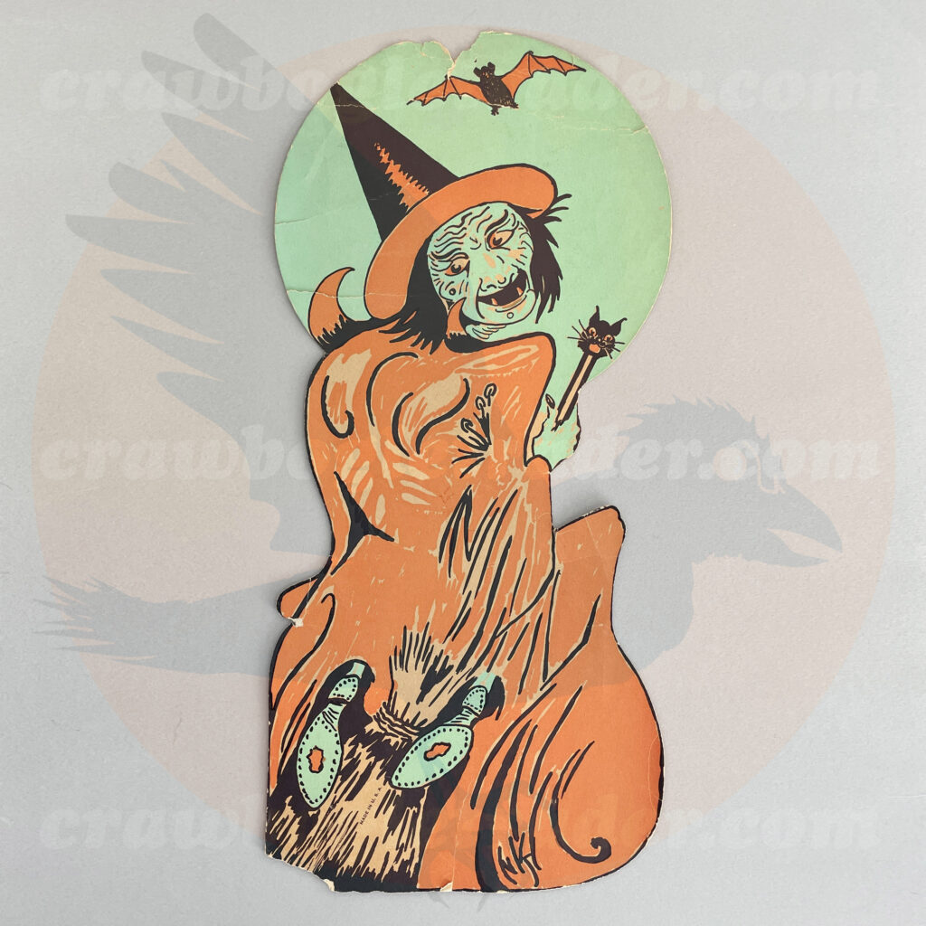 Classic mid-century and sixties to later vintage Halloween collectible by Beistle - an orange dress witch in front of a full green moon, riding her broom and holding a cat-face wand as a batch flies above her. Just one of many Halloween collection items up for trade from Craw Bogle Trader (while other options for buying and selling items may be considered upon contacting the online store).